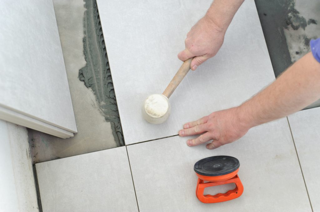 Tap The Tile by Wooden or Rubber Mallet