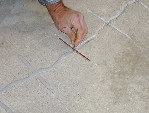 Repair of cracks in concrete