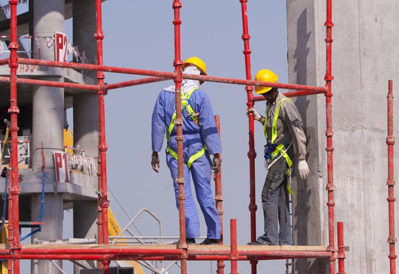 Worker Wearing Safety Belt During Scaffolding
