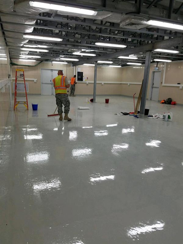 Epoxy flooring by professional worker