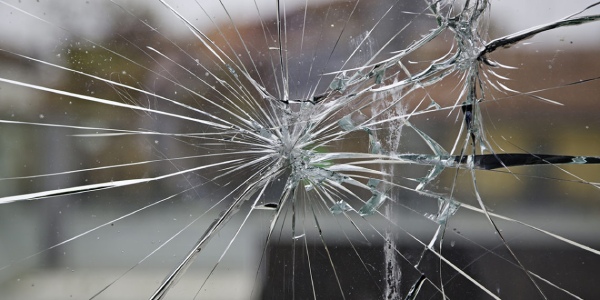 Broken window glass due to brittleness
