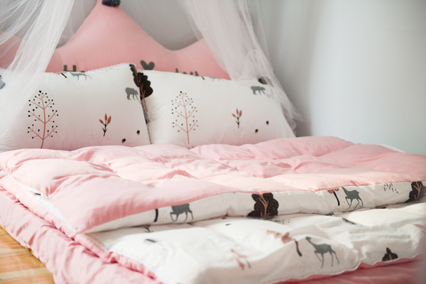 Pink Bedsheets and white Cushions