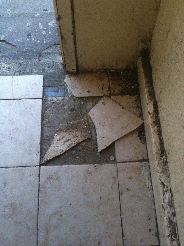 Tiles Detaching from Floor