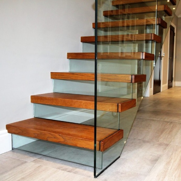 Wooden stairs with glass riser and balustrade