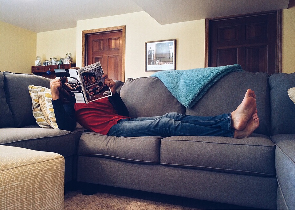 Person Relaxing on Sofa