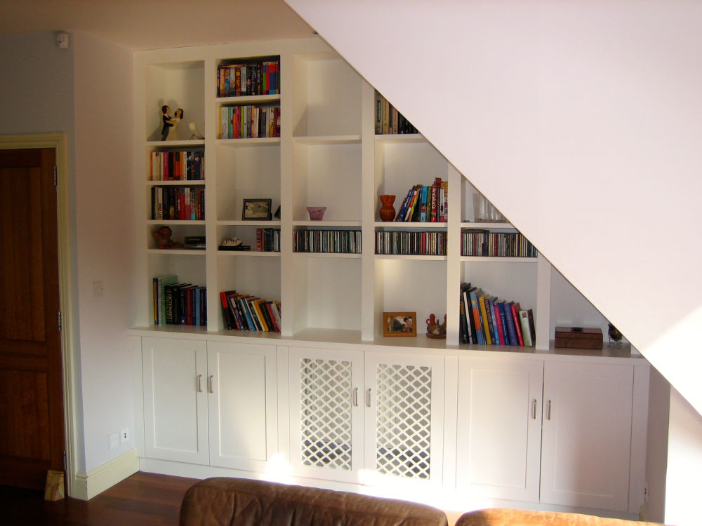 Create Racks Under Stair to Keep Valuable Books